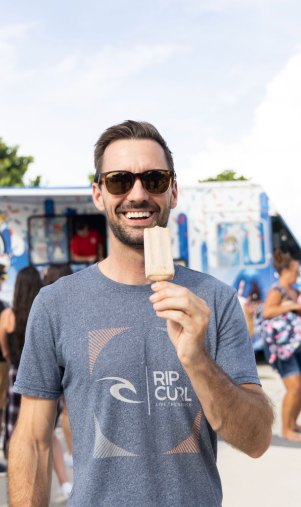 gentleman posing with an ice cream in his hand